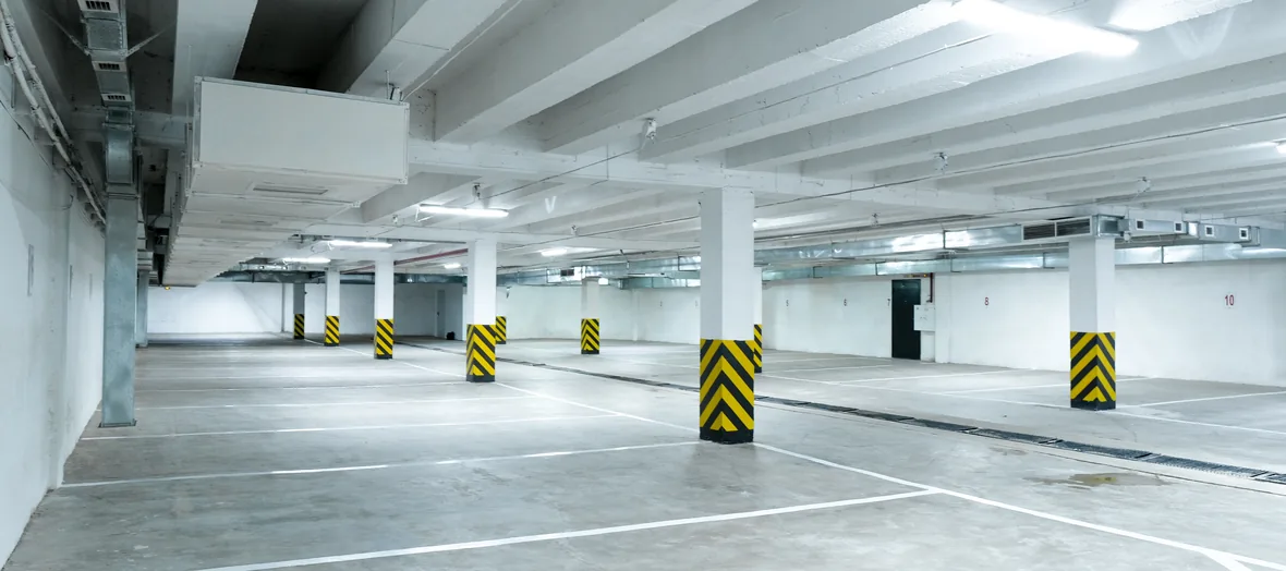 Open-plan car park interior with concrete columns
