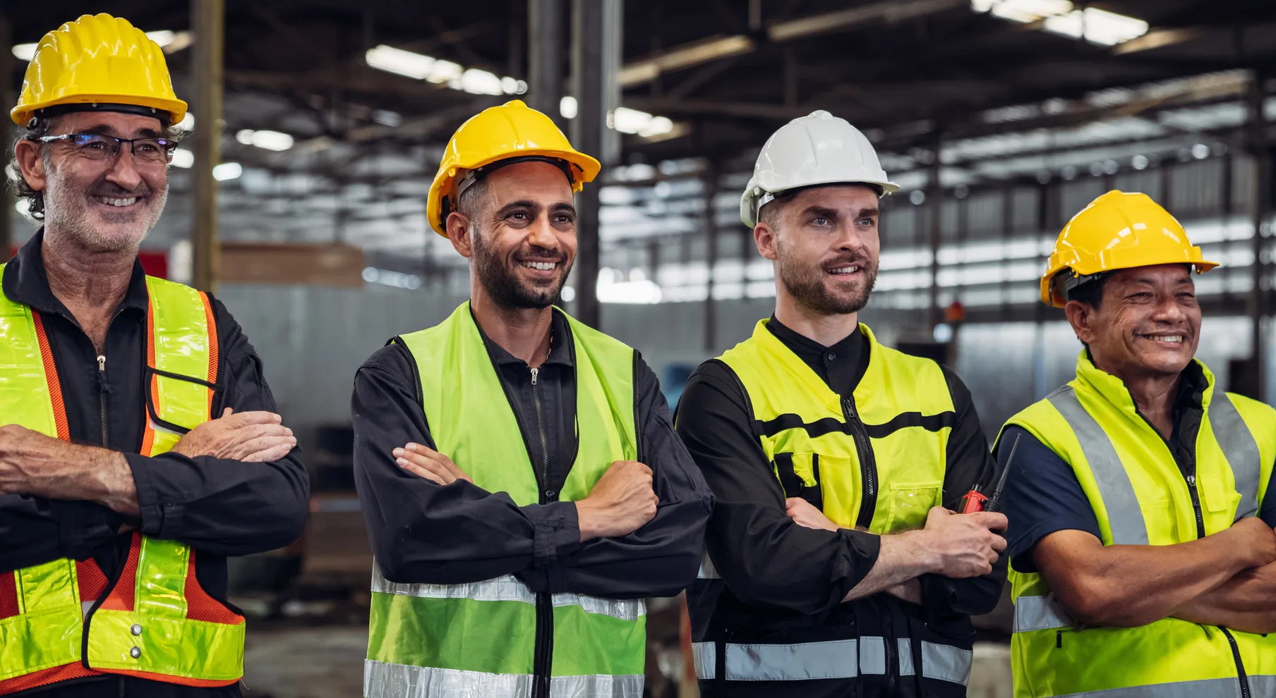 Build With Steel team members in hi-vis and hard hats inside the factory