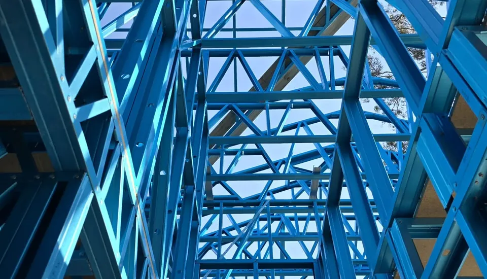 Looking up through a blue-coated light gauge steel frame