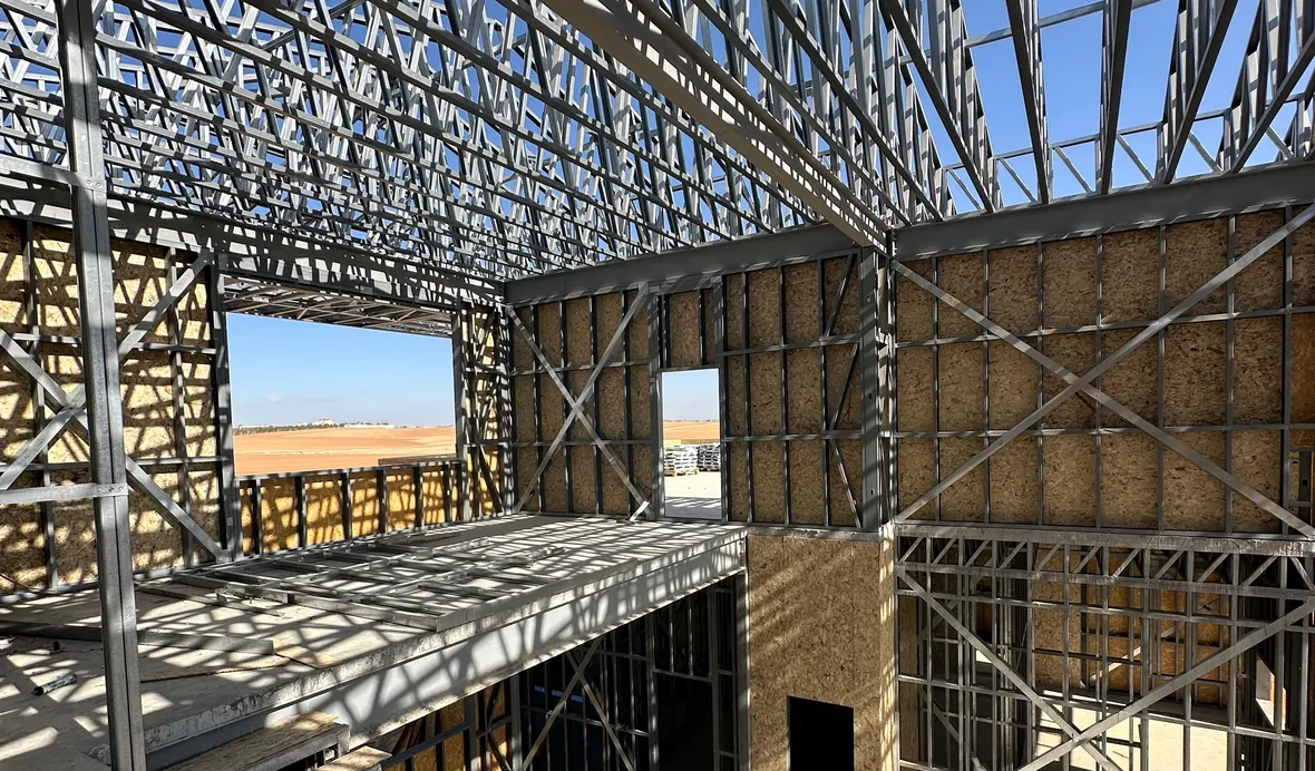 Light gauge steel wall panels and roof trusses under a clear sky on a Build With Steel project