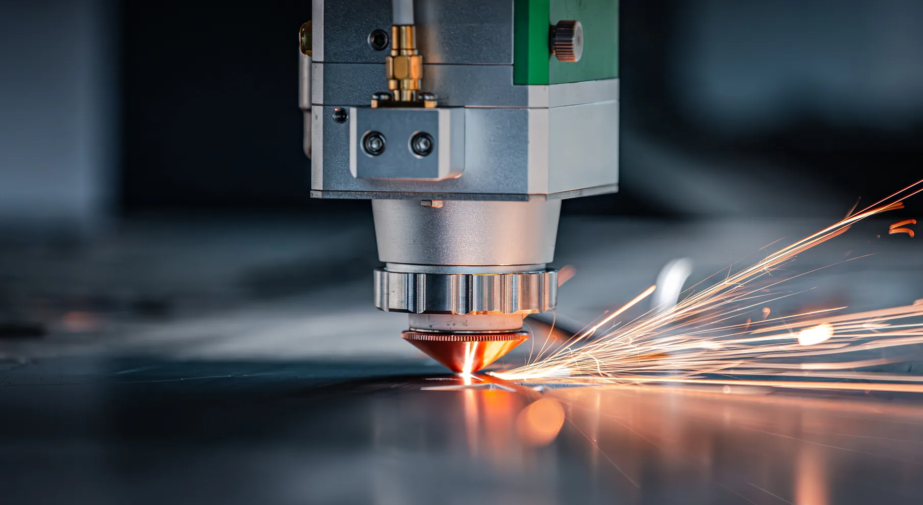 Laser cutting machine cutting steel with sparks in the factory