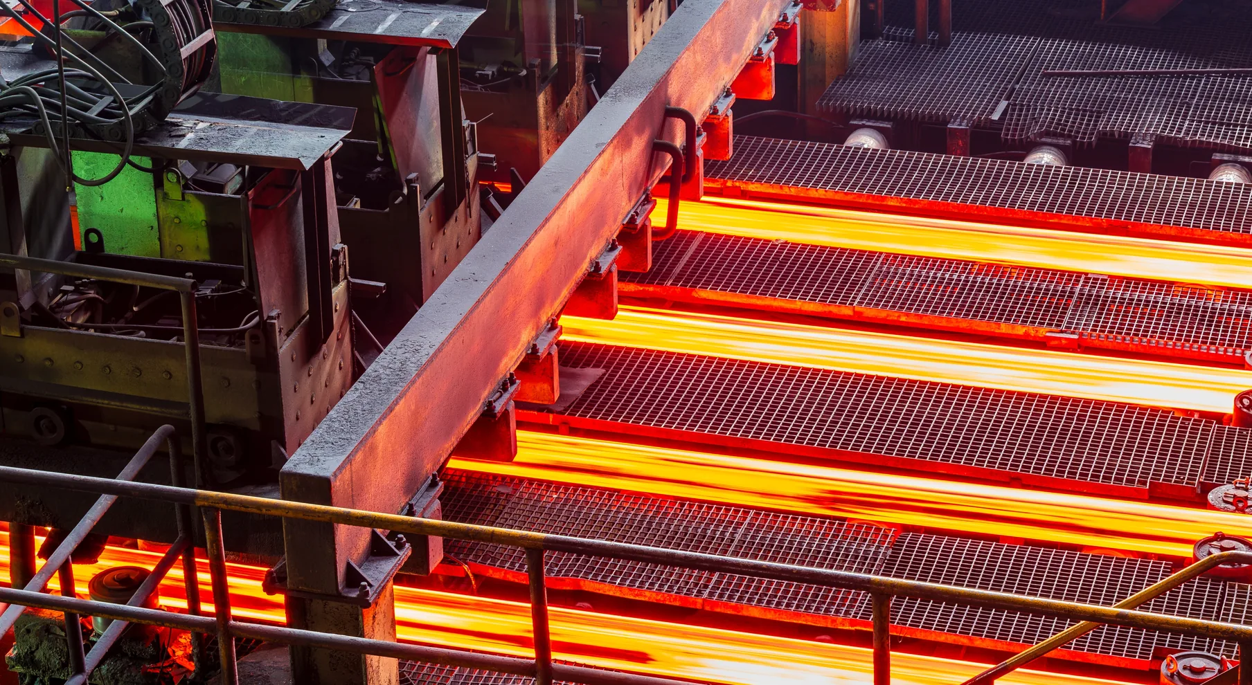 Red-hot steel strip passing through a rolling mill