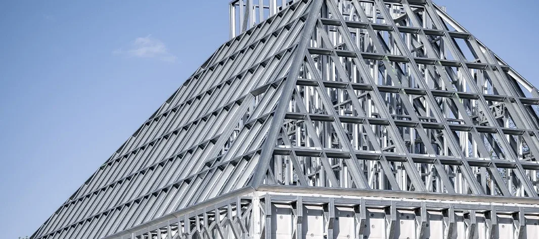 Light gauge steel roof truss and wall frames of a building