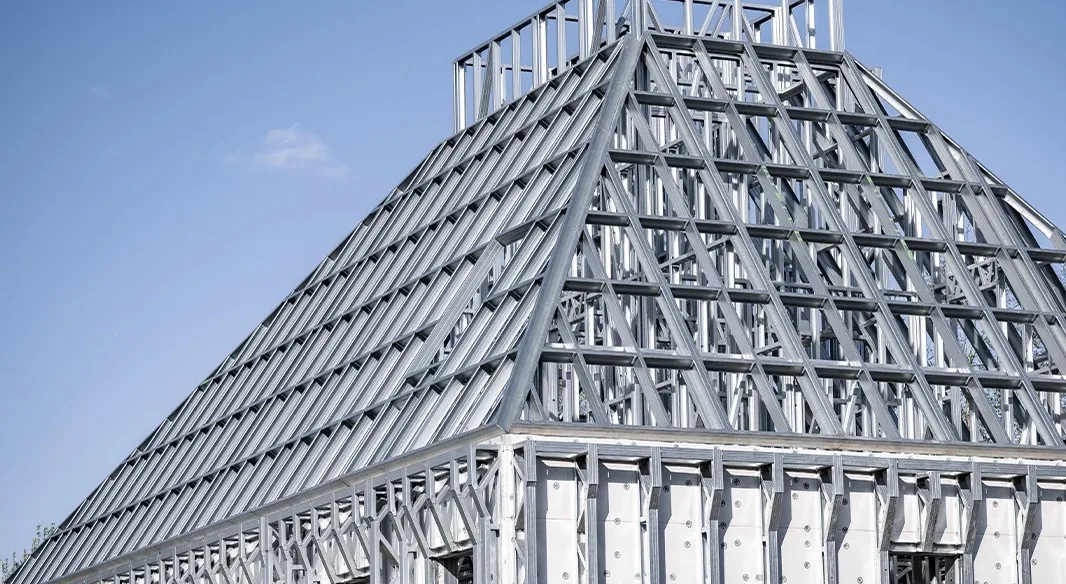 Light gauge steel roof truss and wall frames of a building
