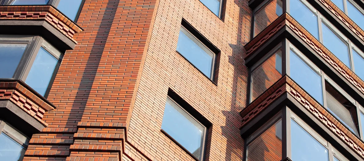 Brick masonry facade with bay windows